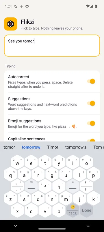 Flikzi in light mode, typing “See you tomor” with the suggestions tomorrow, Timor and tomorrow's above the hexagon keys